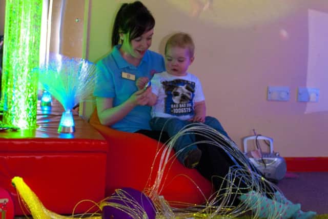 Ryan Black enjoys the newly opened sensory room at the Alphabet House Nursery, Farnsfield with staff member Kerry Shannon, The sensory room which will help children with special needs has been made possible, thanks to the fundraising efforts of Ryan's mum Sally-Anne Charlton.