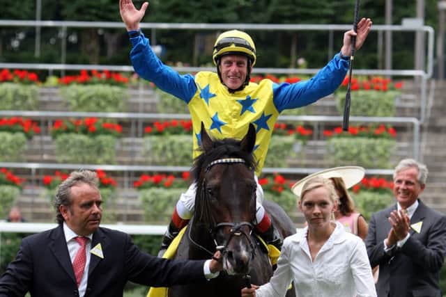 KING GEORGE GLORY -- jockey Johnny Murtagh celebrates victory on board Novellist in last year's King George at Ascot (PHOTO BY: Steve Parsons/PA Wire)