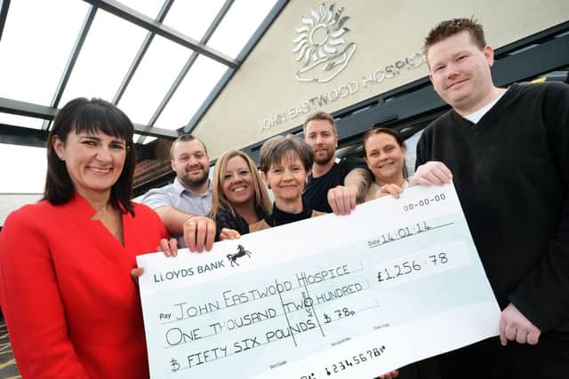 Staff from St. Andrews Healthcare, hand over their £1,256.78 cheque to manager, Diane Humphries, centre, during a visit to the John Eastwood Hospice last Tuesday. The group, made up of 9 employees, raised the money on a survival of the fittest challenge which included a 12k run and 10 obstacle courses held in Nottingham last year. Pictured are from left, Lisa Powell, Neil Shanks, Helen Poole, Diane Humphries, Matt Temple, Maxine White and Luke Seagrave.