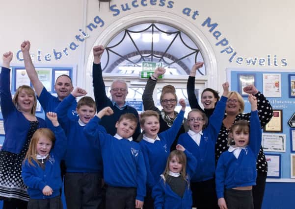 Mapplewells Primary and Nursery School headteacher Claire Varley, chair of governors Ken Sharpe, staff and pupils were celebrating on Tuesday after the school was given an outstanding grade by Ofsted