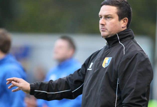 Mansfield Town's manager Paul Cox is in favour of terracing.