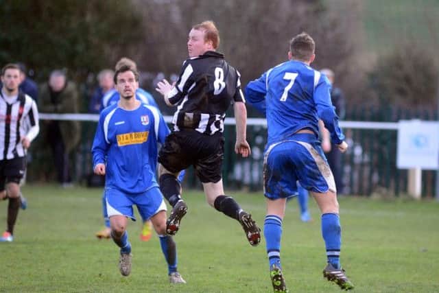 Clipstone v TeversalClipstone's Jason Edwards out jumps his marker.