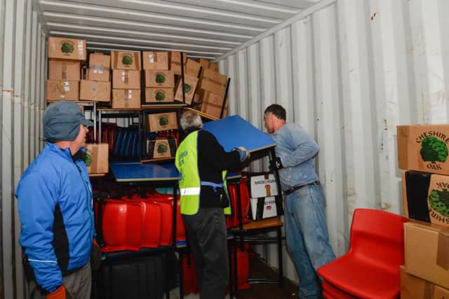A container full of school items and medical help is on its way to Ghana courtesy of North Yorkshire based charity, PhysioNet. The charity was set up by Peter Thompson, of Lower Dunsforth near Boroughbridge, in 2005 and has despatched aid to Africa, India, Europe and Fiji. Volunteers load the container on Saturday morning ready for delivery to the Lawra district of Ghana.picture mike cowling dec 14th 2013