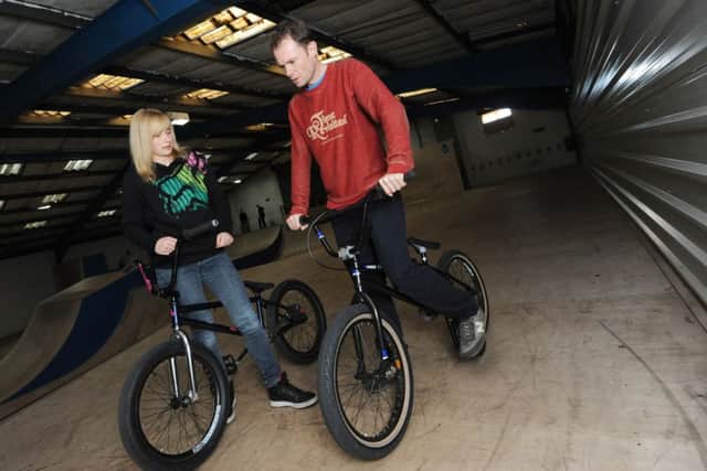 Asylum Skatepark, Huthwaite.Kayley Ashworth showing Chad reporter Ben McVay how to ride a BMX.