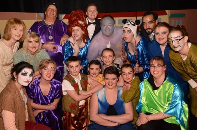 Panto cast in Aladdin at the Sutton Academy Theatre which featured Jack Burrows as the Widow Twankey, Rosie Knight as Aladdin and the Genie played by Bob Lee.