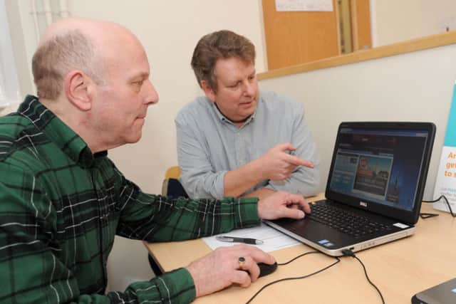 Computer training sessions at Hucknall Library. Pictured left is Trevor May a Hucknall resident taking lessons from Michael Rogers from WEA UK Online Centres.