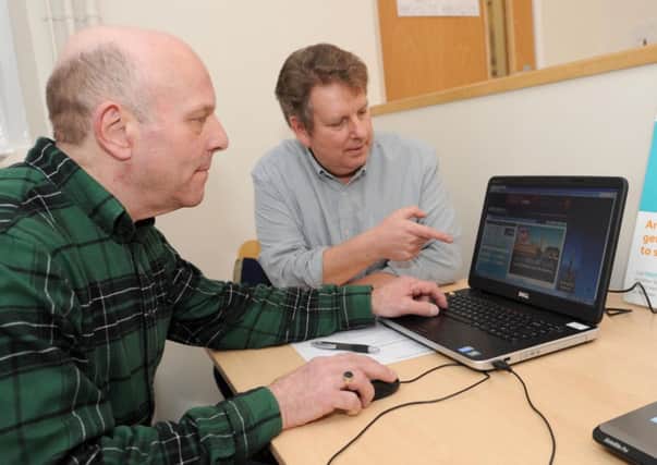 Computer training sessions at Hucknall Library. Pictured left is Trevor May a Hucknall resident taking lessons from Michael Rogers from WEA UK Online Centres.