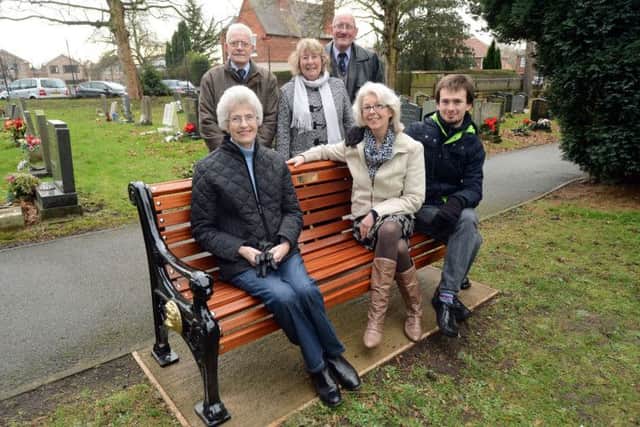 Jessie Mardell, seated left, a with her daughter and grandson, Trish and Adam Davis pictured at the dedication of a memorial bench at Bestwood St. Mark's cemetery. Also pictured are standing from left, Coun. Arthur Fox-Smith, Mary Hall and Denis Beeston.
