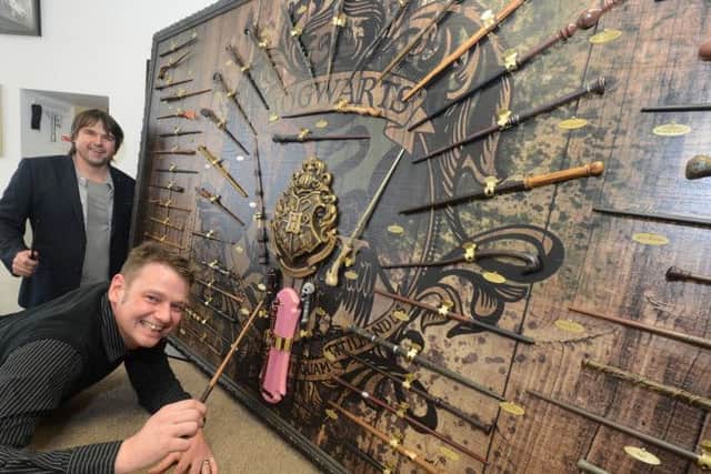 Harry Potter wand collecter Richard Hutton with Alwyn Morris who took on the challenge of creating a way to display them all