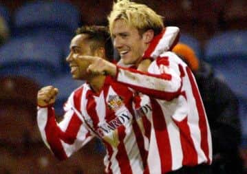 Sunderland's Liam Lawrence celebrates his opening goal against Burnley with team-mate Jeff Whitley (left) during the Coca-Cola Championship match at Turf Moor, Burnley, Friday March 4, 2005. PRESS ASSOCIATION Photo. Photo credit should read: Gareth Copley/PA. THIS PICTURE CAN ONLY BE USED WITHIN THE CONTEXT OF AN EDITORIAL FEATURE. NO UNOFFICIAL CLUB WEBSITE USE.