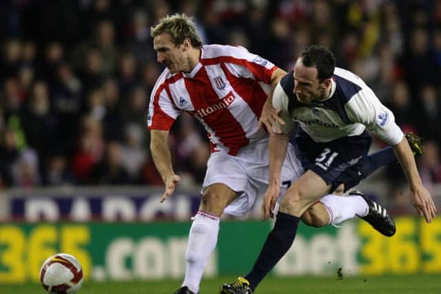 Bolton Wanderers' Andrew O'Brien (right) and Stoke City's Liam Lawrence battle for the ball during the Barclays Premier League match at the Britannia Stadium, Stoke. PRESS ASSOCIATION Photo. Picture date: Wednesday March 4, 2009. See PA story SOCCER Stoke. Photo credit should read: Dave Thompson/PA Wire. RESTRICTIONS: Use subject to restrictions. Editorial print use only except with prior written approval. New media use requires licence from Football DataCo Ltd. Call +44 (0)1158 447447 or see www.paphotos.com/info/ for full restrictions and further information.
