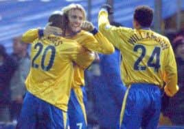 On target: Liam Lawrence celebrates scoring, along with Lee Williamson and Junior Mendes, in 2003.