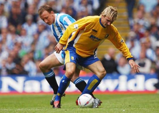 Huddersfield's Pawel Abbott (left) and Mansfield's Liam Lawrence battle for possession during the Nationwide Division Three play-off final Monday May 31, 2004, at the Millennium stadium in Cardiff . See PA story SOCCER Third.  PA photo: Matthew Fearn.  THIS PICTURE CAN ONLY BE USED WITHIN THE CONTEXT OF AN EDITORIAL FEATURE. NO UNOFFICIAL CLUB WEBSITE USE.