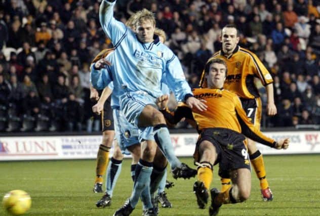 Battling hard: Laim Lawrence fights or possession with Hull's Ben Burgess.