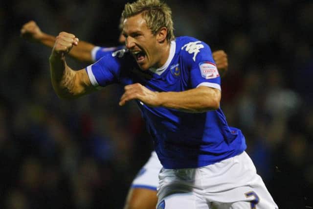 Liam Lawrence celebrates during his stint with Portsmouth.