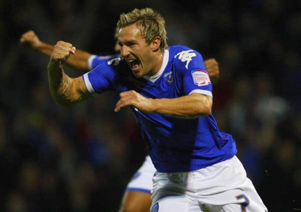 Liam Lawrence celebrates during his stint with Portsmouth.