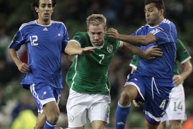 Ireland's Liam Lawrence is tackled by Andorra's Oscar Sonejee during the UEFA Euro 2012 Qualifying match at the Aviva Stadium, Dublin. PRESS ASSOCIATION Photo. Picture date: Tuesday September 7, 2010. See PA story SOCCER Republic. Photo credit should read: Niall Carson/PA Wire.