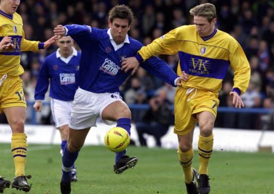 Chesterfield Town's Stuart Howson and Mansfield Town's Liam Lawrence (R) battle for the ball during their Nationwide Division Two match at the Recreation Ground, Chesterfield, Saturday January 18, 2003. PA Photo: Steve Parkin
THIS PICTURE CAN ONLY BE USED WITHIN THE CONTEXT OF AN EDITORIAL FEATURE. NO UNOFFICIAL CLUB WEBSITE USE.