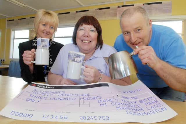 Elaine Thompson, dementia support worker, and Diane and Paul Hawkins.