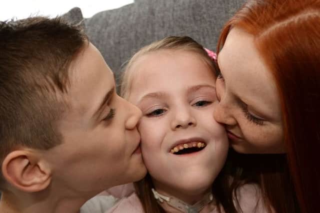 Lillie-May Holey with her brother and sister, Ben and Kaci at their Forest Town home.