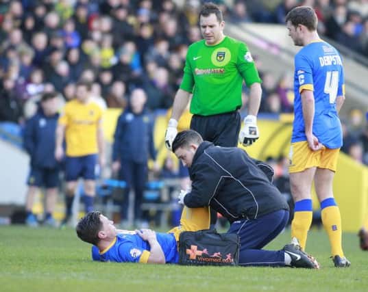 James Jennings receives treatment from Physio Simon Murphy -Pic by: Richard Parkes