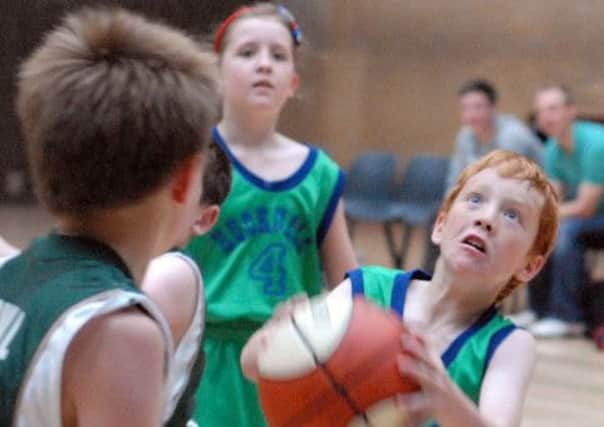 Players from the U10's and U12's Hotshots Basketball teams take part in a demonstration game ahead of a children's tournement as part of the Byron Festival at the Hucknall Leisure Centre on Sunday.