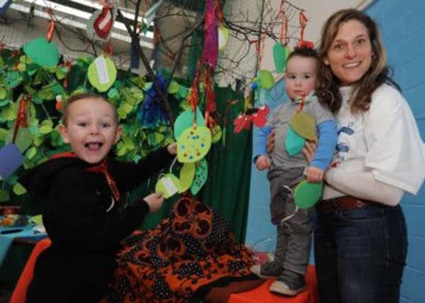 Family Fun Day during half term at Bulwell Riverside Centre. Jude Maidment 6 and brother Jared with Manya Beneson.