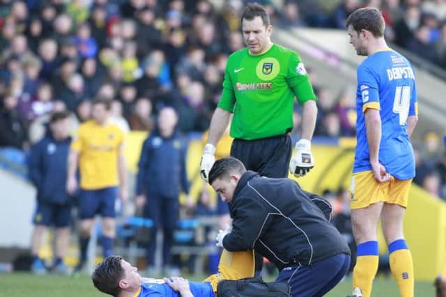 James Jennings receives treatment from Physio Simon Murphy -Pic by: Richard Parkes