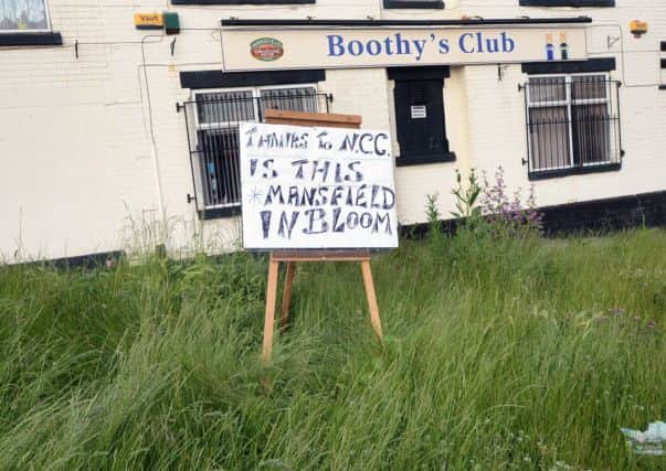 Grass cutting protest sign outside Boothy's Club in Mansfield.