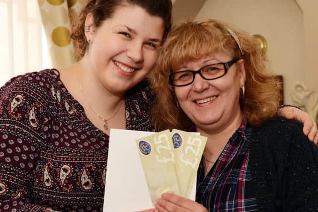 Whitney May gives her mum, Coral, a cuddle and her Mother's Day gift vouchers.
