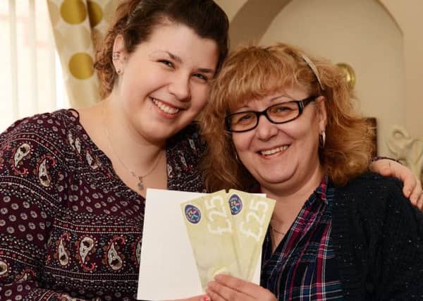 Whitney May gives her mum, Coral, a cuddle and her Mother's Day gift vouchers.