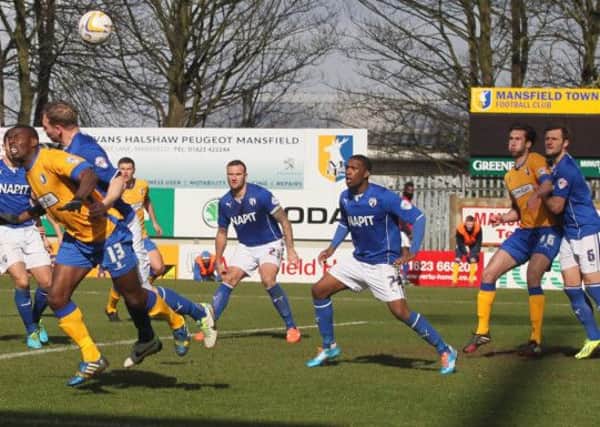 Anthony Howell heads the ball wide from a tight angle for Mansfield-Pic by: Richard Parkes