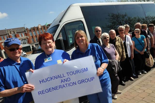 free bus tour for Hucknall Tourism and Regeneration Group (HTRG). Pictured front l-r is Pat Richards tour guide, Sheila Robinson organiser and Kathy Williams escort.