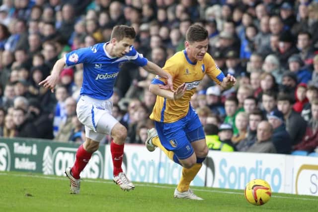 James Jennings skips past Pompey's Marcos Painter -Pic by: Richard Parkes