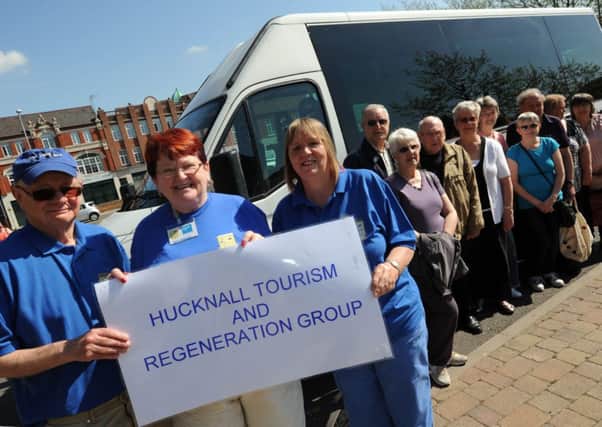free bus tour for Hucknall Tourism and Regeneration Group (HTRG). Pictured front l-r is Pat Richards tour guide, Sheila Robinson organiser and Kathy Williams escort.