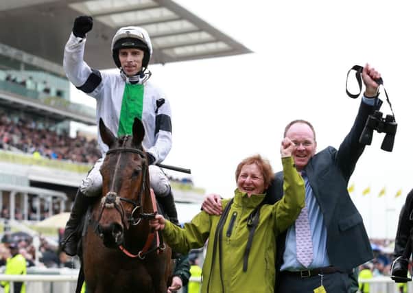 JUST WHAT THE DOCTOR ORDERED -- part-time trainer Dr Richard Newland (right) celebrates Grand National success with jockey Leighton Aspell aboard Pineau De Re (PHOTO BY: David Davies/PA Wire)