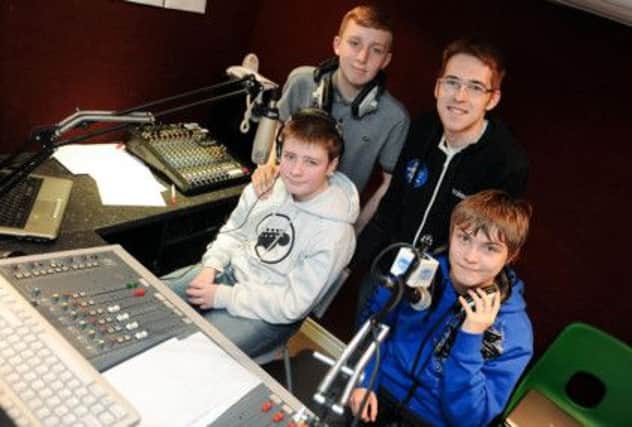 Sutton Community Academy's Takeover Radio is training youngsters in the Easter holidays, known as 'Takeover's Extra Easter'. Pictured is Children's Producer Craig Priest (top right) with Cameron Felton 14 (left) and bottom is Nathan Tomlinson 15 and Jon Shaw 16.