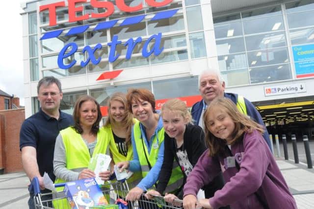 NHUD12-1615-1
Volunteers collect food for the Bestwood and Bulwell Fod Bank at the Tesco Bulwell store on Saturday. Pictured from the left are, Nigel Webster, Jackie Oldfield, Annie Edis, Denise Mead, Amy Mead, Ron Wright and Katie Oldffield