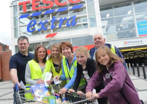 NHUD12-1615-1
Volunteers collect food for the Bestwood and Bulwell Fod Bank at the Tesco Bulwell store on Saturday. Pictured from the left are, Nigel Webster, Jackie Oldfield, Annie Edis, Denise Mead, Amy Mead, Ron Wright and Katie Oldffield