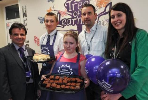 Opening of new Attic Cafe at Sutton Community Academy. Pictured l-r is Simon Martin, Principal, Ben Gregory (15),  Chelsea Jepson (13), Jimmy Ruther, Catering Enterprise Coordinator, and Liz Barrett.