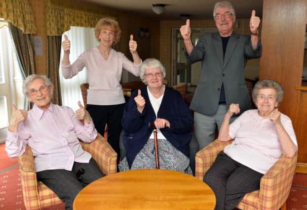 Residents celebrate after housing complex is saved, pictured are back Joy and Barry Middleton, seated from left Olga Wild, Pam Clarke and Kathleen Radford