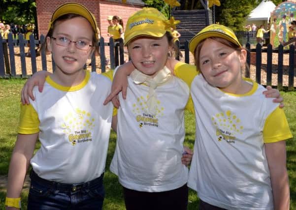 Over 3,000 Brownies and their leaders gathered at Wheelgate Theme Park for a big birthday party to celebrate the Brownie centenary. Pictured are Phoebe Heale, Frankie Gratton-Fisher and Betsy Meads from 
3rd Rainworth Brownies