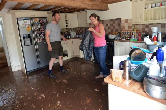 Southwell flood.
Catharine and Will Haywood who returned home early from a holiday in Cornwall to find their Easthorpe home deep in flood water and mud.