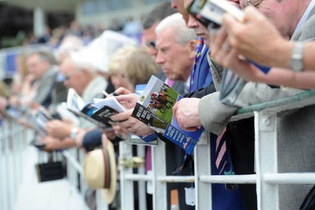 Date:15th May 2014, picture James Hardisty, (JH100369l). Ladies Day at York Race Course Dante Festival, pictured Race goers watching the main race of the day The Betfred Dante Stakes.