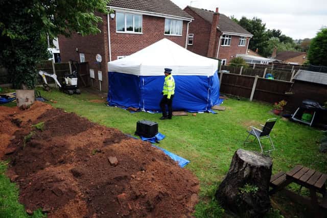 A general view of a police tent in the garden of a house in Blenheim Close, Forest Town, near Mansfield, where the remains of two people have been found. PRESS ASSOCIATION Photo. Picture date: Friday October 11, 2013. See PA story POLICE Remains. Photo credit should read: Rui Vieira/PA Wire