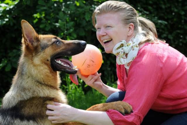 Rose Cullip makes friends with Dodo, who is being re-homed by her dad, John Renshaw of Annesley Woodhouse. Dodo who is an alsation cross, was found abandoned at the Ashfield District Council offices and is around 18 months to two years old.