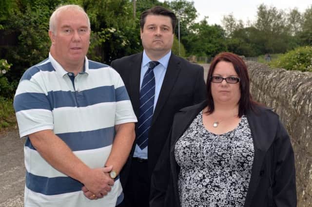The family of Phil Dawn and councillors are campagining for a bridge over the level crossing near Kings Mill reservoir. Pictured are John Dawn, Coun Darren Langton and Phil's sister Tracy Hart