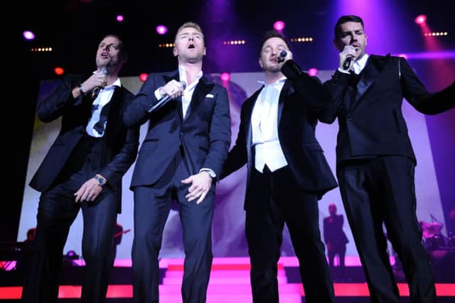 NOTE: EDITORIAL USE ONLY

Boyzone (left to right) Keith Duffy, Ronan Keating, Mikey Graham and Shane Lynch of Boyzone perform at the Motorpoint Arena, Cardiff, for the Boyzone 20th anniversary tour. PRESS ASSOCIATION Photo. Picture date: Sunday December 1, 2013. Photo credit should read: Tim Ireland/PA Wire