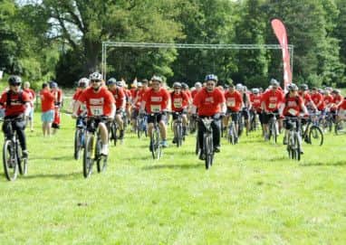 A sea of red as the Bikeathon riders begin their adventure through Clumber Park.