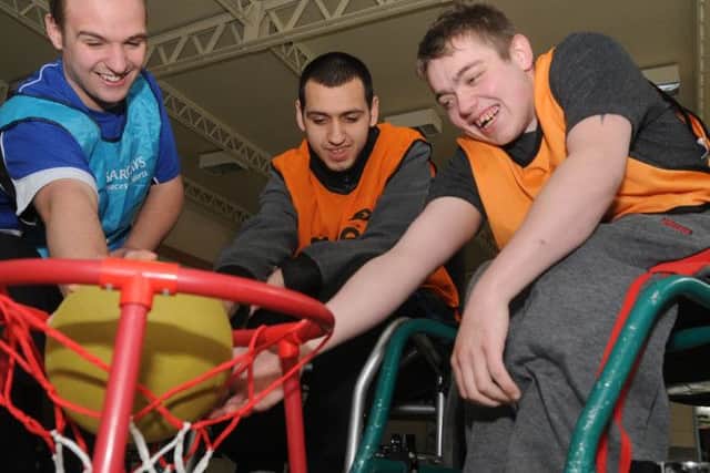 Students and volunteers take part in Wheel chair basket ball at Portland training college today from the left Zac Day ,Josh Martin and Vinny Dooley